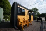 Single-floor tiny house fits working and living spaces into 21 ft