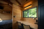Single-floor tiny house fits working and living spaces into 21 ft - Image 4